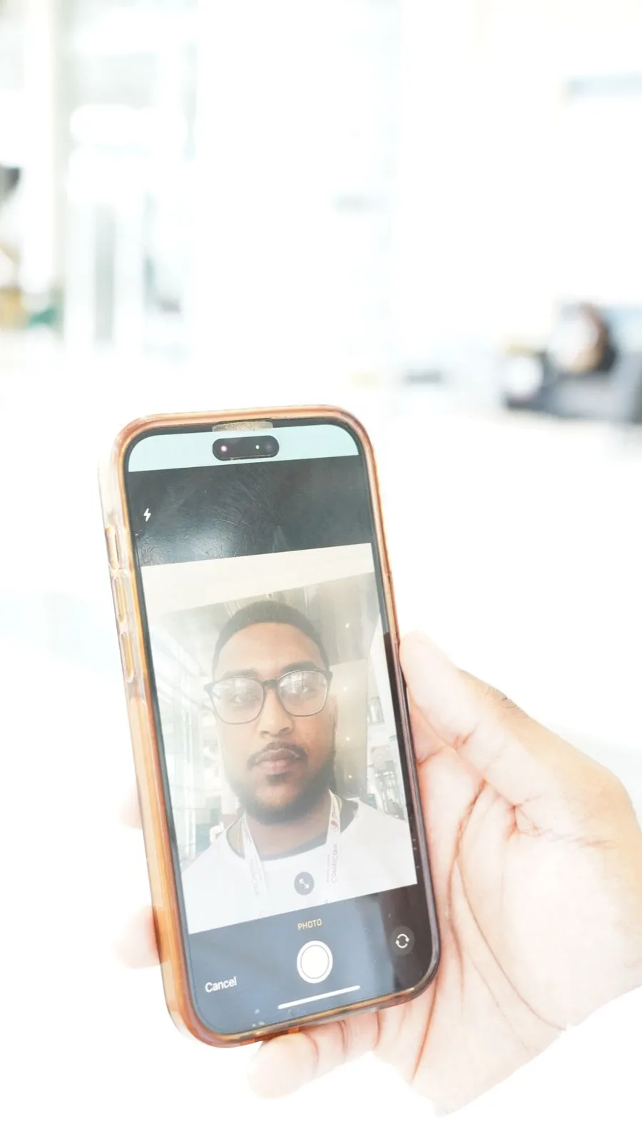 Attendee taking a selfie with the phone camera inside the event app flow