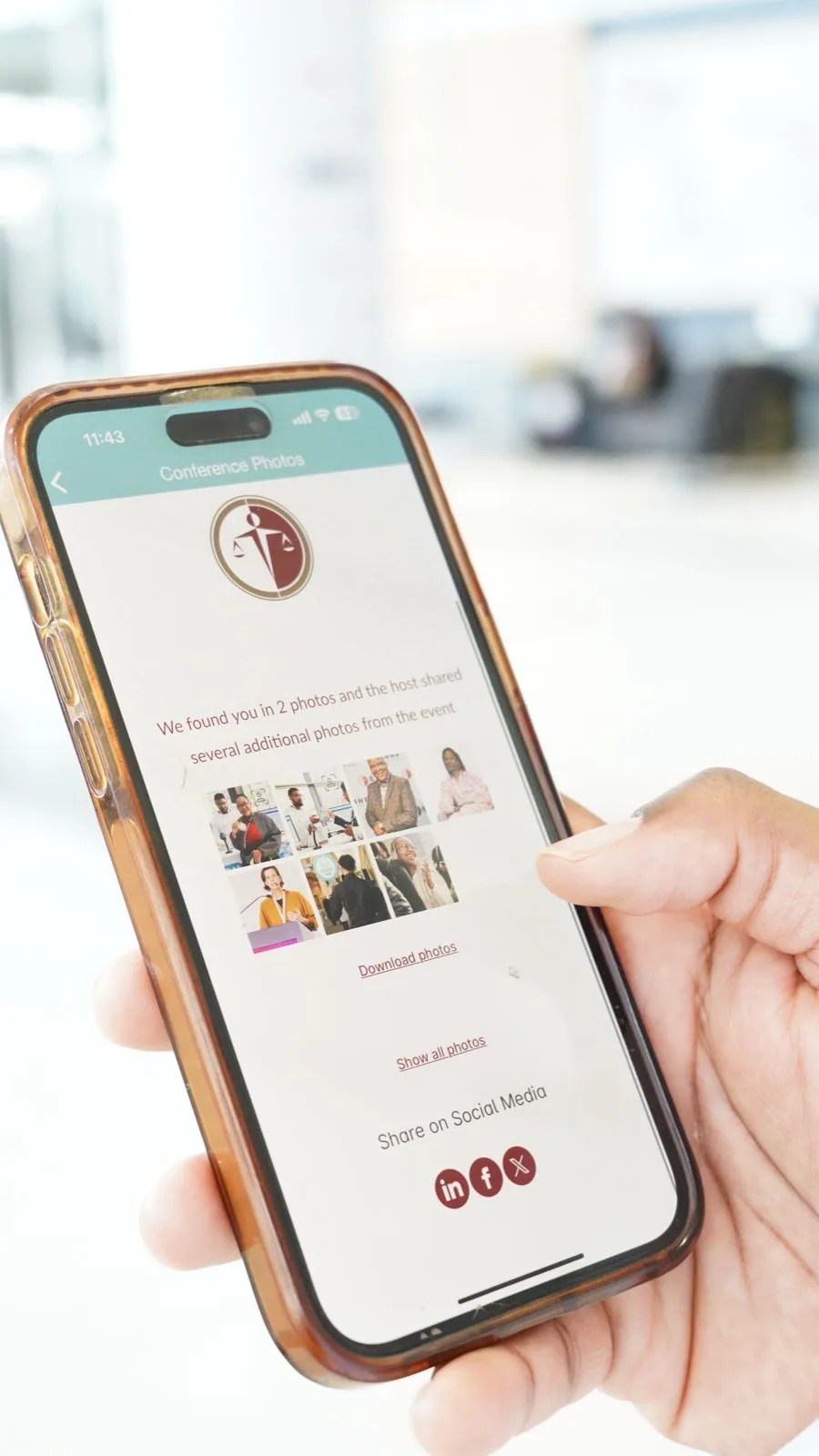 The Hub showing the attendee's personal photos found from their selfie, with download and share options