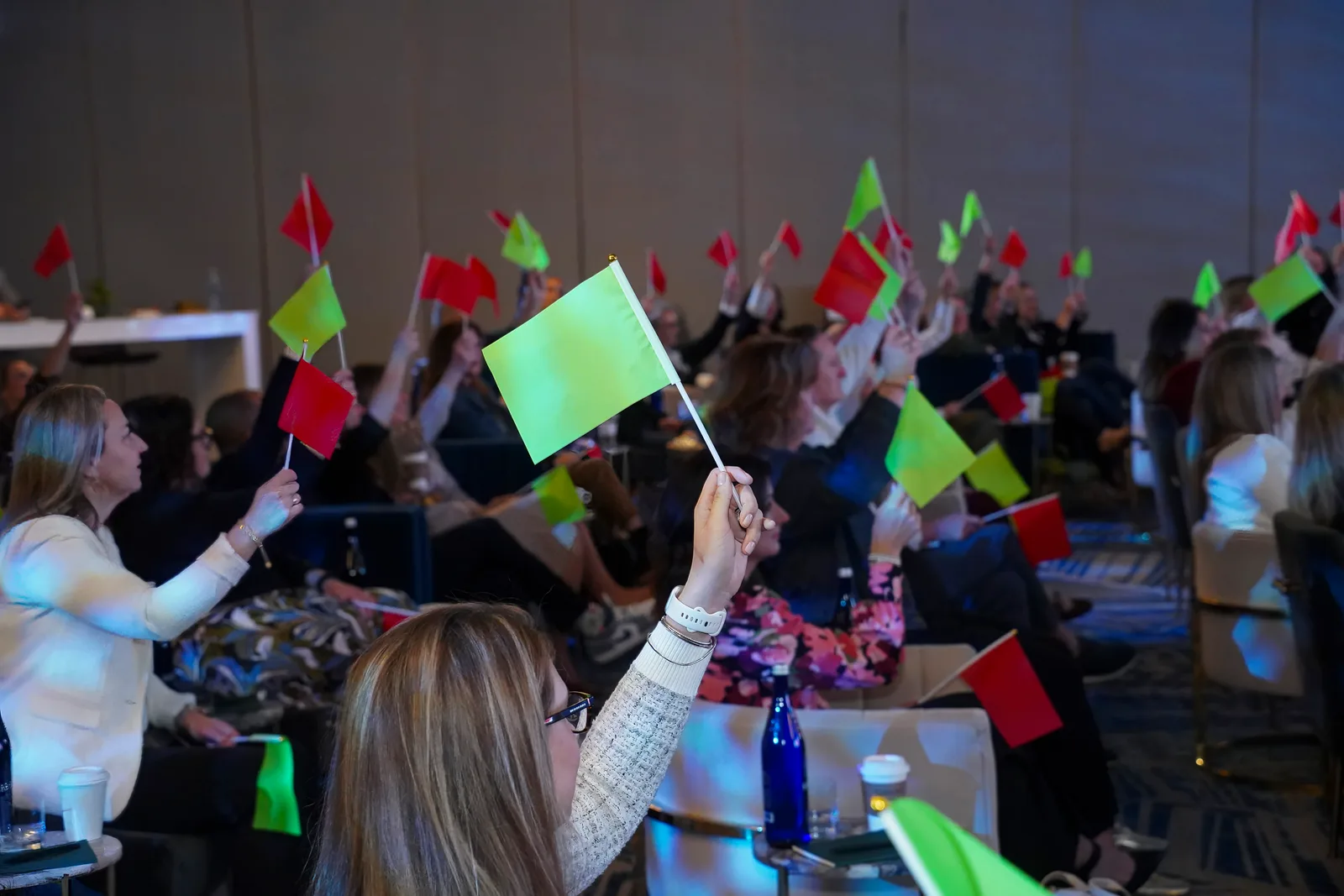 ELX North American Summit 2026 attendees raising coloured flags during an interactive session at the Hyatt Regency Orlando